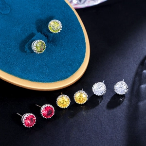 Macro detail of crown setting earrings with colorful multi-faceted cubic zirconia stones