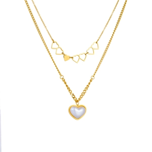 Double layered gold chain necklace featuring hollow hearts and a pearl heart pendant