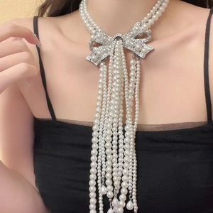 Elegant multi-layer pearl choker with silver rhinestone bow and long tassel pendant