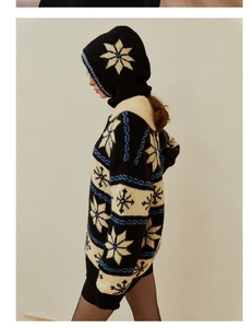 Detailed knit texture of wool balaclava featuring winter snowflake jacquard patterns