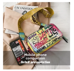 Detail view of colorful graffiti camera bag with wide strap and side zip pocket