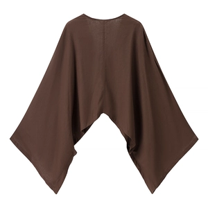 Detail view of brown loose batwing sleeve top with textured linen fabric and uneven hemline