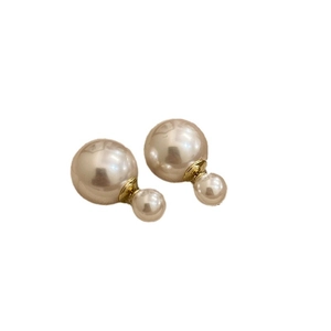 French vintage champagne double-sided pearl earrings with elegant gold accents on white base