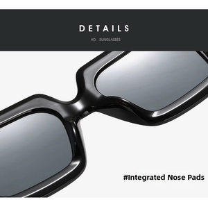 Macro detail of integrated nose pads on glossy black square oversized sunglasses