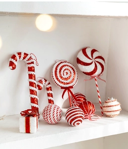 Detailed view of red and white glitter Christmas ornaments including candy canes and balls