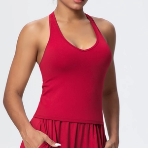 Detail of dark red yoga tank top showing fine stitching and brushed elastic fabric texture
