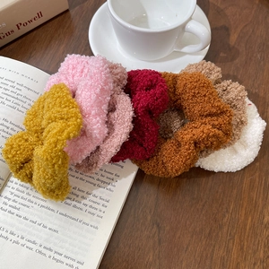 Teddy fleece scrunchies set in autumn colors on a cozy lifestyle background