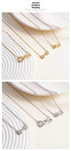 Close-up of gold and silver infinity pendant necklaces with zircon inlay on ceramic tile
