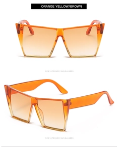 Detail of square oversized sunglasses featuring orange yellow gradient lenses and frame