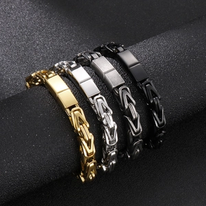 Men's Byzantine steel bracelets in gold, silver and black shown on a display stand