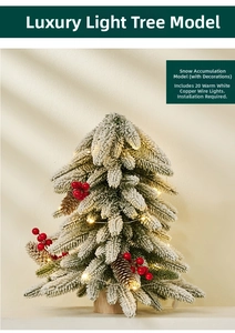 Mini tabletop snowy Christmas tree with red berries, pine cones and warm LED lights