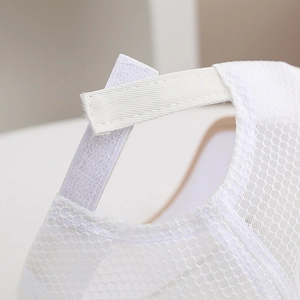Detail of adjustable velcro strap and breathable mesh on white kids baseball hat