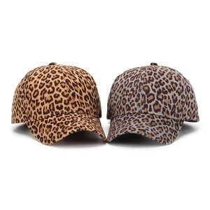Detailed comparison of leopard print baseball caps in tan and grey suede texture