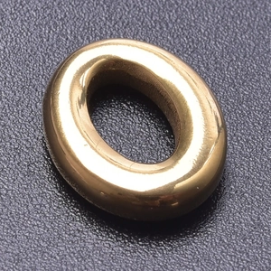 Macro shot of polished gold-plated stainless steel oval buckle for DIY jewelry