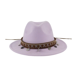 Detailed view of lavender wool felt fedora with ethnic woven band and coin pendants