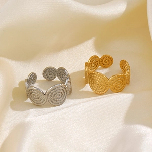 Adjustable spiral textured rings in gold and silver finish on elegant satin fabric