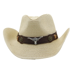 Close-up of cowboy straw hat with bull head silver emblem and leather trim details
