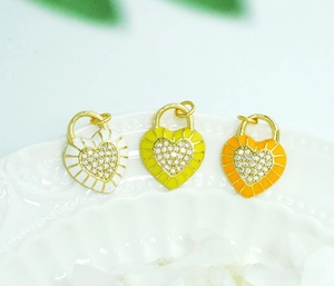 Detail of 18K gold plated heart lock charms with colorful enamel and zircon inlay