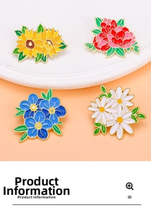 Detail of four floral enamel pins including sunflower and peony on a minimalist tray