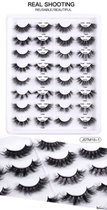 Macro detail of 16 pairs of dense handmade false eyelashes showing texture and varying lengths