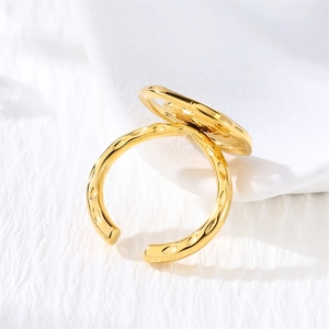 Detailed close-up of 18K gold-plated irregular hammered texture on adjustable ring
