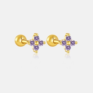 Detail of clover stud earrings with purple zircons and secure gold screw ball backings
