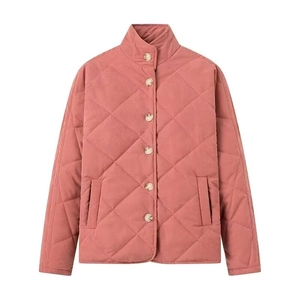 Detail view of pink quilted puffer jacket featuring a stand collar and diamond pattern