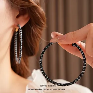 Retro round leather hoop earrings with white NICE letter print for modern women fashion