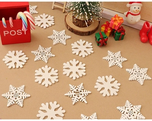 Close-up of wooden snowflake ornaments with mini mailbox and dollhouse Christmas decor