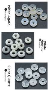 Detailed close-up of white agate, white turquoise, and clear quartz round beads