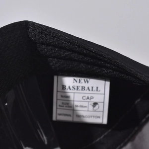 Macro view of 100% cotton baseball cap interior label showing 56-58cm size