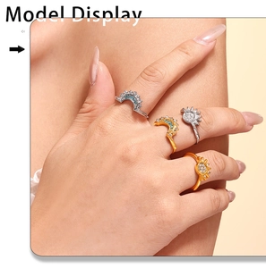 Model wearing gold and silver sun and moon rings set with turquoise and zircon stones