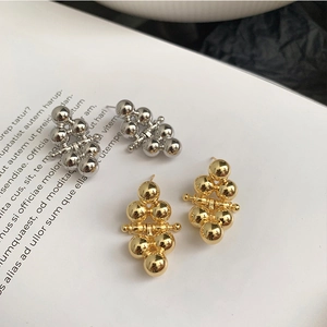 Minimalist 925 silver needle ball earrings in gold and silver finish with geometric balls