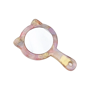 Cat ear handheld vanity mirror with pink acetate tortoiseshell pattern and round glass