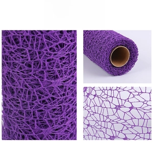 Detail of purple jacquard mesh roll showing hollow-out texture for bouquet decoration
