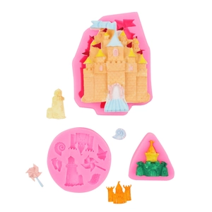 Detail of pink silicone mold with 3D castle and seashell fondant finished products