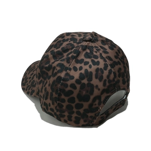 Detail of leopard print baseball cap featuring the adjustable strap and six-panel design