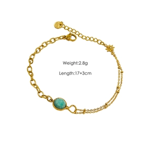 Detail of adjustable star charm bracelet with natural turquoise and dual gold chains