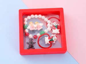 Close-up of a red 3D floating film display case showcasing Christmas-themed jewelry set