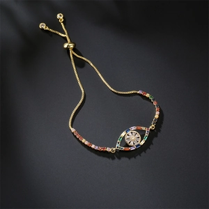 Detailed close-up of gold-plated evil eye bracelet with colorful zirconia inlays