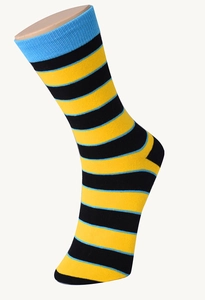 Detailed view of men's cotton crew sock with bold black, yellow, and blue stripes