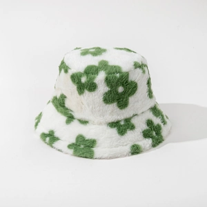 Detail view of plush faux rabbit fur bucket hat with cute green floral patterns