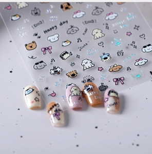 Detailed view of cute cartoon nail stickers featuring dogs, bears, and laser reflective effects