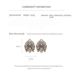 Detailed size specifications for vintage earrings with pearls and rhinestones on white background