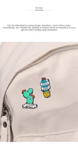Close-up of cute cactus enamel pins on canvas bag with Hug Me and Lookin Sharp text