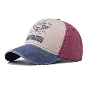 Detail of vintage washed cotton baseball cap with skull print and distressed brim edges