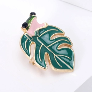 Vintage enamel frog brooch with green leaves and black rhinestone eyes on gold metal