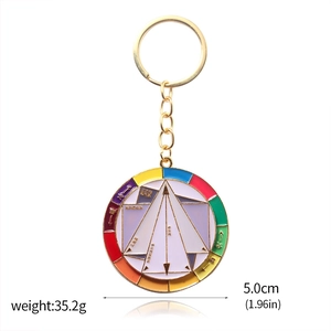 Detailed close-up of a 5cm enamel color wheel keychain with golden alloy finish
