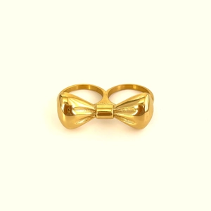 Bague double doigt dorée à nœud papillon en acier titane poli au design élégant
