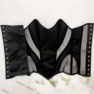 Detail of black corset top showing mesh and satin fabric textures with silver metal eyelets